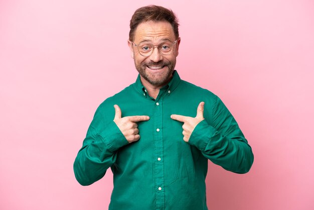 Middle age caucasian man isolated on pink background