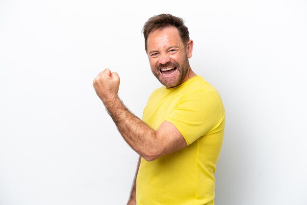 Middle age caucasian man isolated on white background celebrating a victory