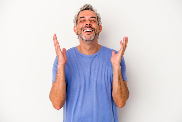 Middle age caucasian man isolated on white background  laughs out loudly keeping hand on chest.