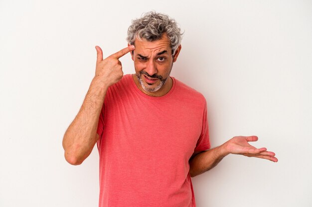 Middle age caucasian man isolated on white background  showing a disappointment gesture with forefinger.