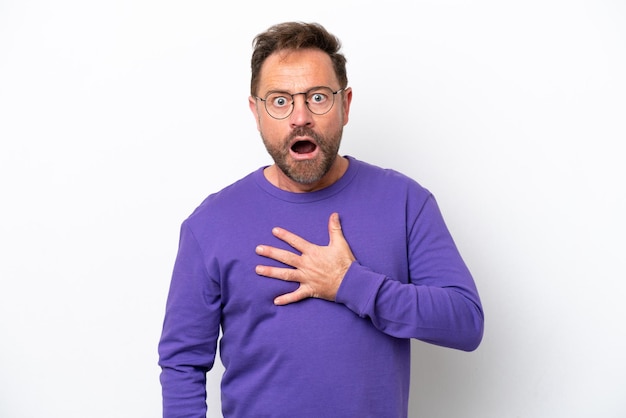 Middle age caucasian man isolated on white background surprised and shocked while looking right