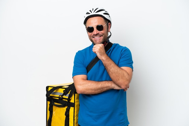 Middle age caucasian man with thermal backpack isolated on white background with glasses and smiling