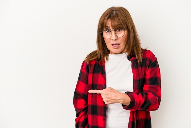 Middle age caucasian woman isolated on white background pointing to the side