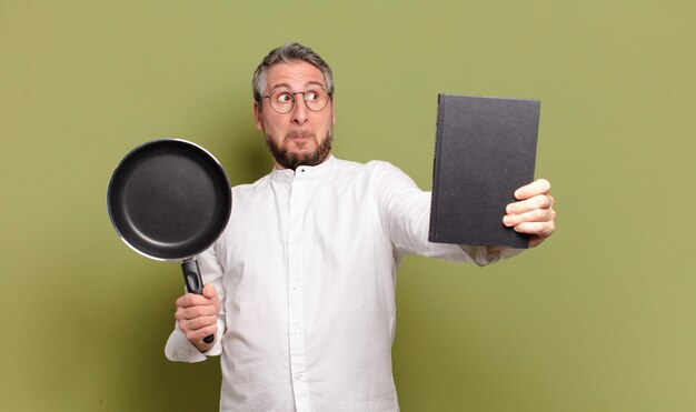 料理を学ぶ中年シェフの男