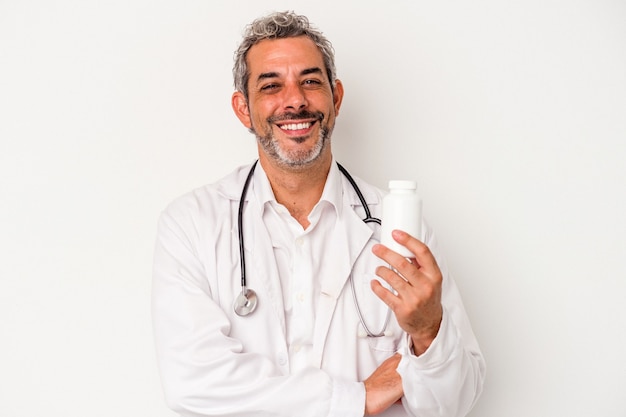 Middle age doctor caucasian man isolated on white background  laughing and having fun.