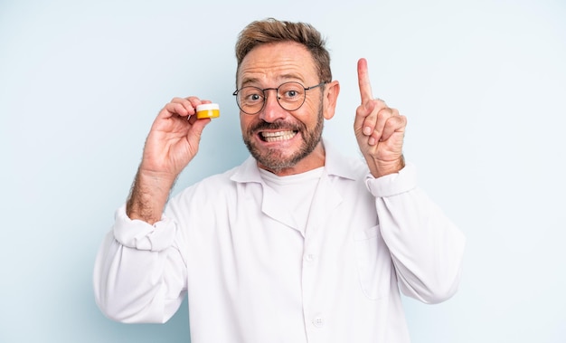 Middle age handsome man feeling like a happy and excited genius after realizing an idea contact lens concept