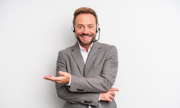 Middle age handsome man smiling cheerfully, feeling happy and showing a concept. telemarketing concept