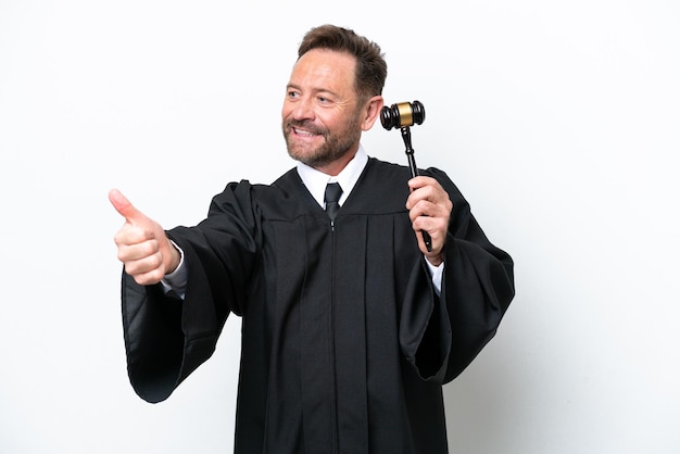 Middle age judge man isolated on white background giving a thumbs up gesture