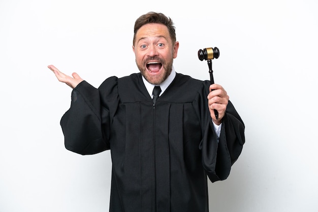 Middle age judge man isolated on white background with shocked facial expression