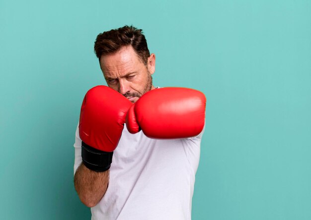 Middle age man boxer with boxing gloves