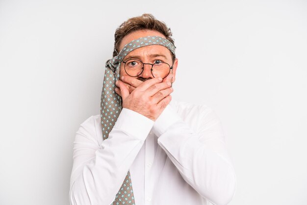Middle age man covering mouth with hands with a shocked. business company party concept