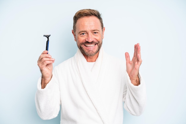 Middle age man feeling happy, surprised realizing a solution or idea. shave concept