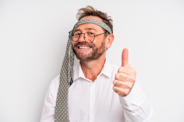 Middle age man feeling proud,smiling positively with thumbs up. business company party concept