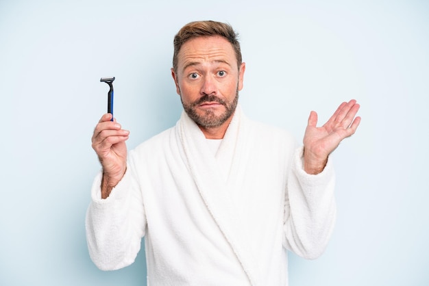 Middle age man feeling puzzled and confused and doubting shave concept