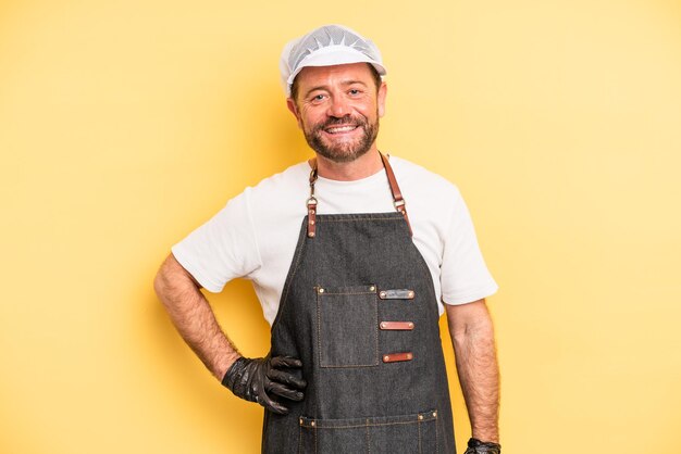 Middle age man smiling happily and daydreaming or doubting fishmonger concept