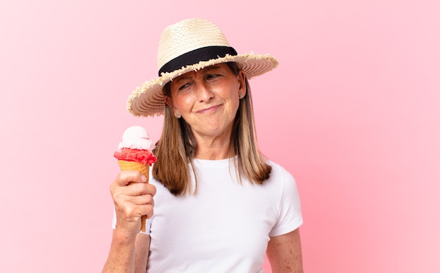 Middle age pretty woman with an ice cream. summer concept