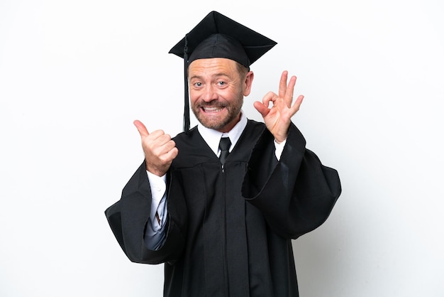 Middle age university graduate man isolated on white background showing ok sign and thumb up gesture