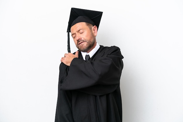 Middle age university graduate man isolated on white background suffering from pain in shoulder for having made an effort