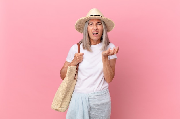 Middle age white hair woman looking desperate, frustrated and stressed. summer concept