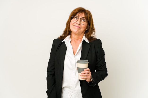 Middle age woman drinking coffee and expressing emotions isolated