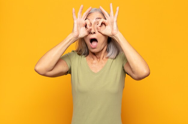 Middle age woman feeling shocked