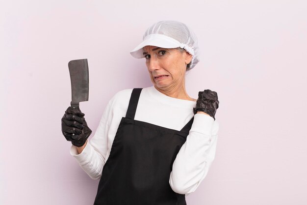 Middle age woman feeling stressed anxious tired and frustrated butcher concept