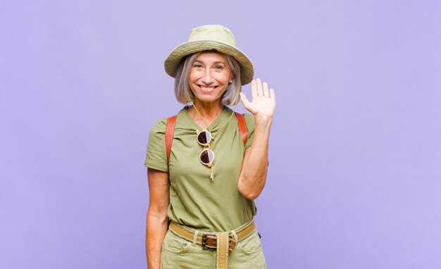 Middle age woman smiling happily and cheerfully