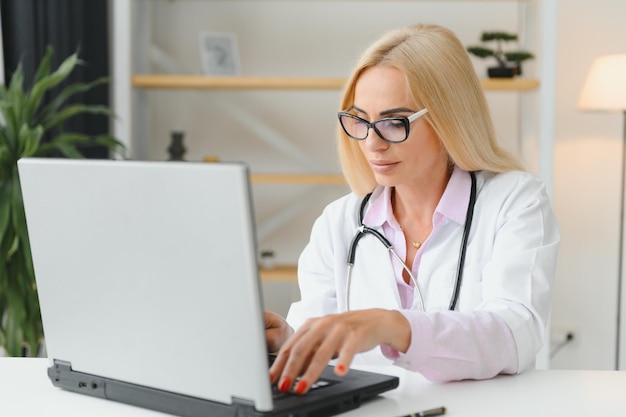 Middle age woman wearing doctor uniform at clinic