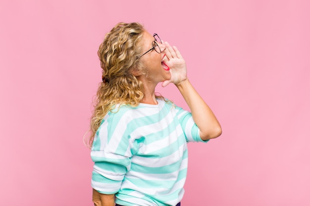 Photo middle age woman with long curly hair isolated