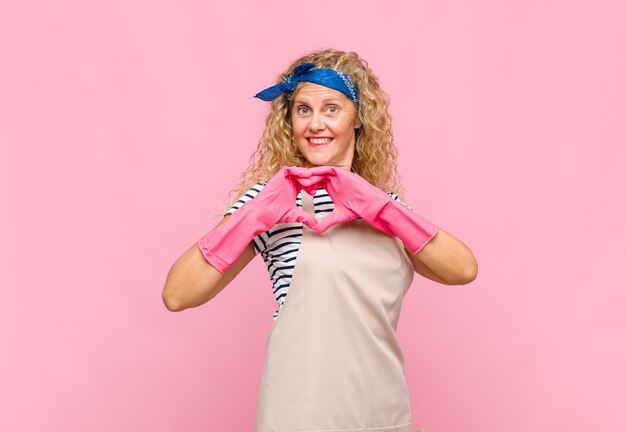 Middle age woman with long curly hair isolated