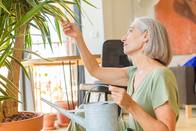 Middle age woman with plants