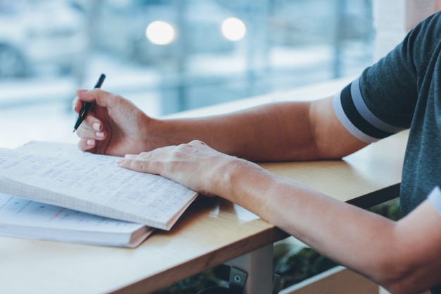 Middle-aged adult woman doing homework on the Chinese language