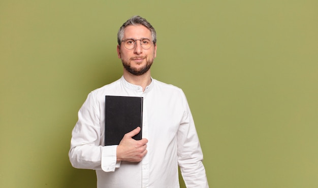 Middle aged businessman with a book