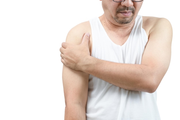 A middle aged man in white veat suffering from arm and shoulder pain isolated