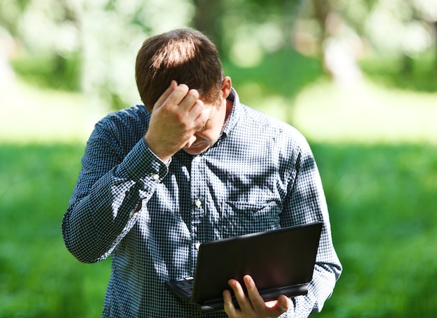 Middle-aged man with laptop