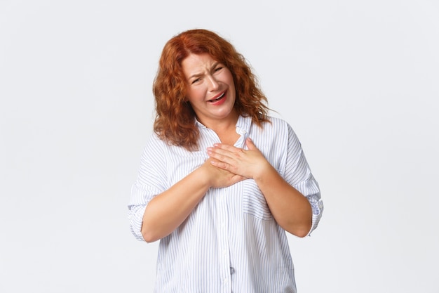 Middle-aged redhead woman posing