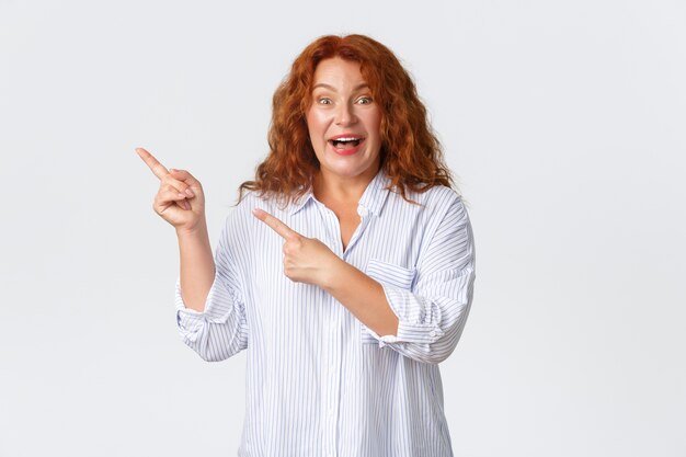 Middle-aged redhead woman posing