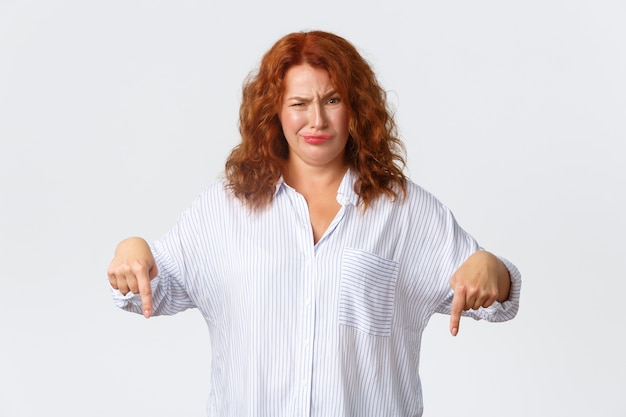 Middle-aged redhead woman posing