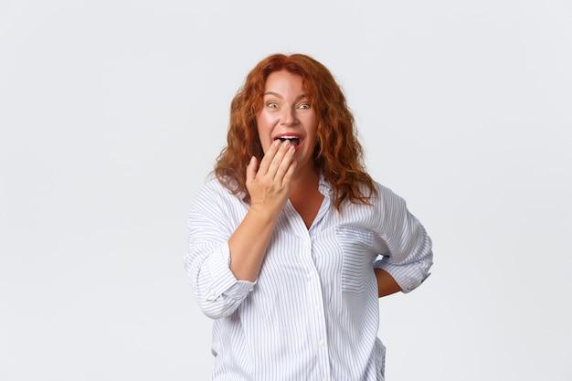 Middle-aged redhead woman posing