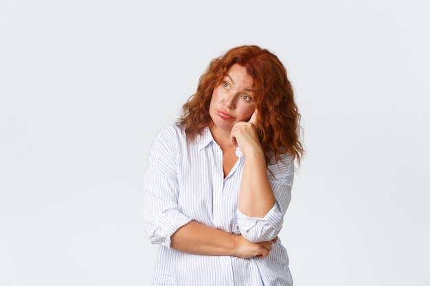 Middle-aged redhead woman posing