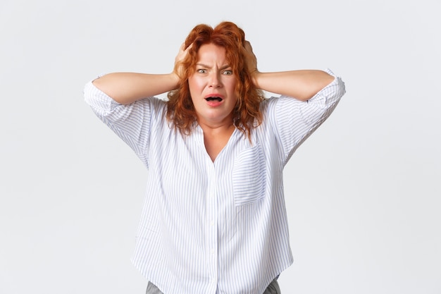 Middle-aged redhead woman posing