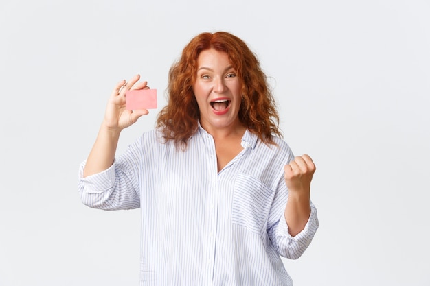 Middle-aged redhead woman posing