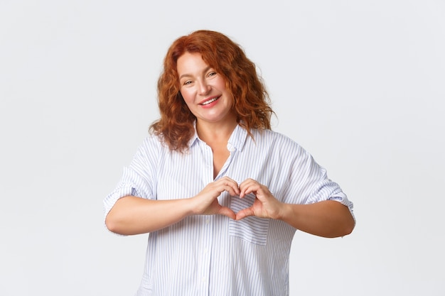 Middle-aged redhead woman posing