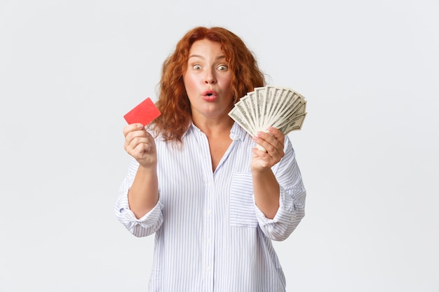 Middle-aged redhead woman posing