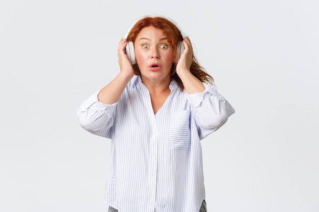 Middle-aged redhead woman posing