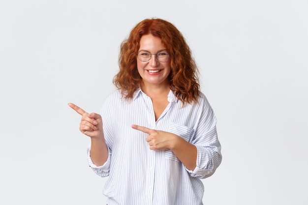 Middle-aged redhead woman posing