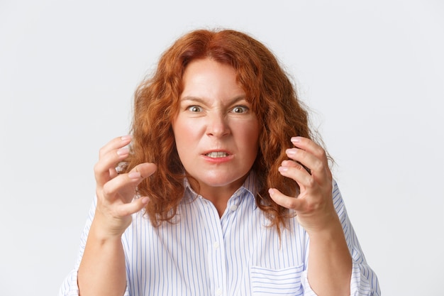 Middle-aged redhead woman posing