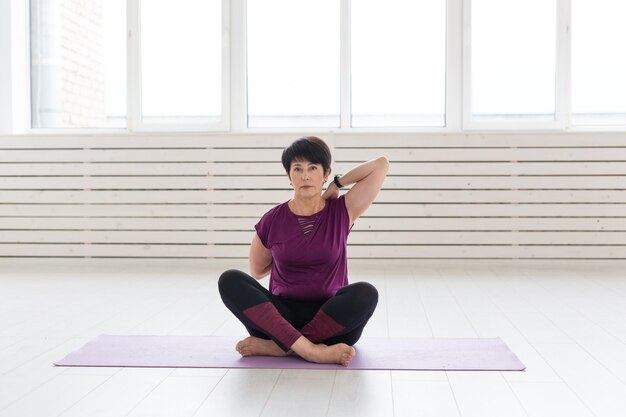 Middle aged woman doing yoga