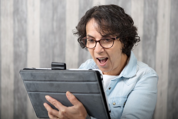 Middle-aged woman making a distant call on internet