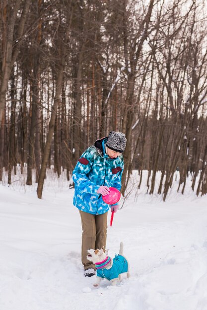 Middle aged woman outdoors with cute dog